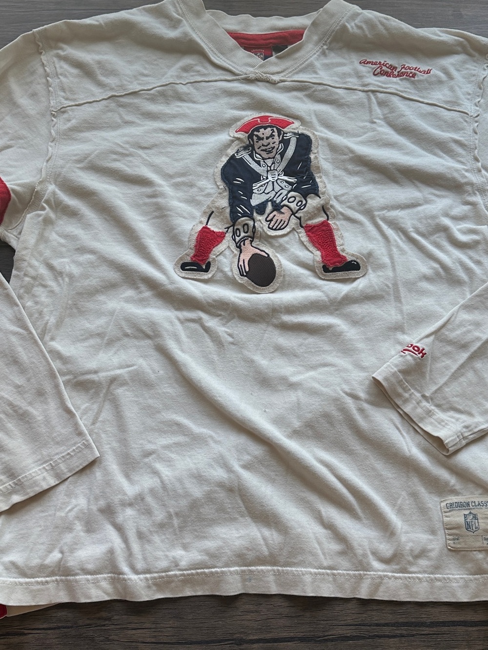 Reebok Patriots White Long-Sleeve Crew with Red & Navy Football Graphic